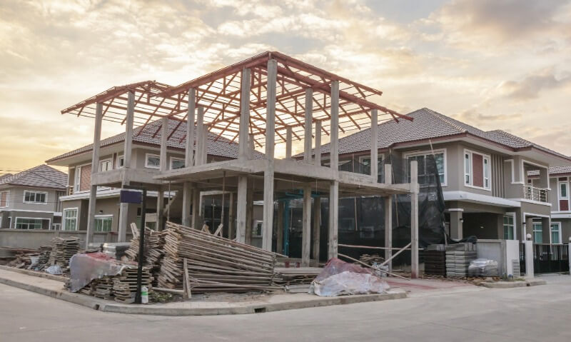Residential building under construction with wood and steel framing